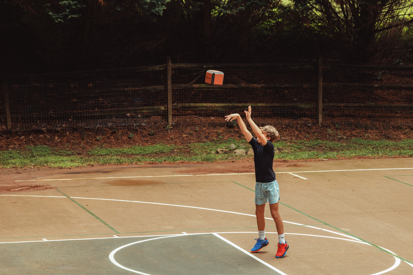 kid training on basketball court